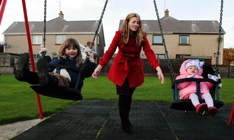 Dawn Geddes with children Carly and Beth at the Winter Place playpark in Carnoustie  one of those now spared.