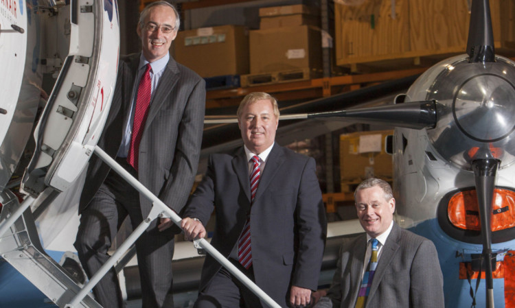 David Harrison, Stewart Adams and Phil Preston of Loganair, which saw profits rise 24% after cutting loss-making Dundee Airport flights.