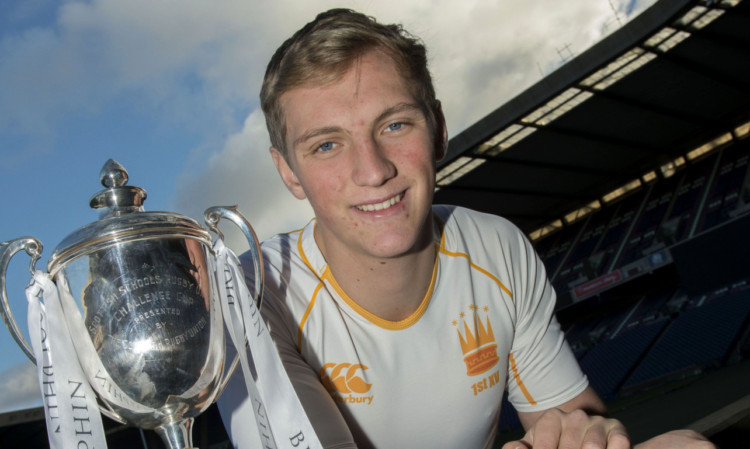 Dundee High captain Chris Jollands with the Brewin Dolphin Cup.