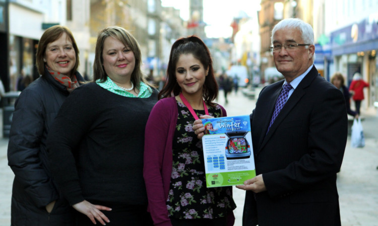 Celebrating the launch of the free parking scheme were city centre management officer Gail Cain, Claire McDiarmid from St Johns Shopping Centre, Tina Sabbagh from Paperchase and Councillor John Kellas.