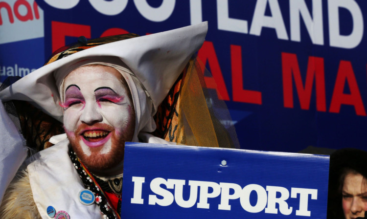 A rally in support of equal marriage outside the Scottish Parliament. Image: PA