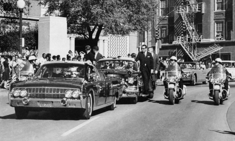 The moment after JFK, in the first car, is shot