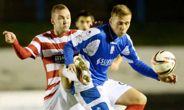 Cowdenbeath's Greg Stewart holds off Hamilton's Grant Gillespie during last weekend's match.