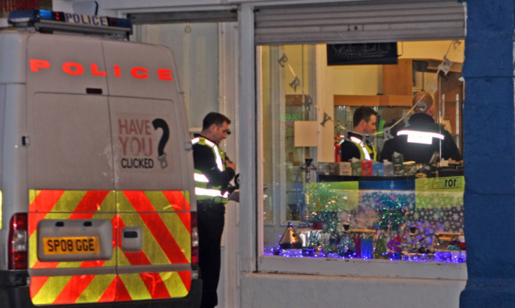 Police at the scene of the robbery in Brothock Bridge, Arbroath.