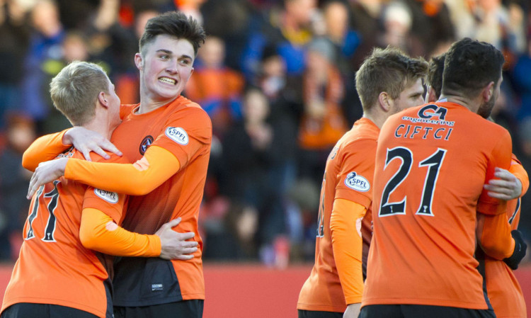 John Souttar (second left) savouring the good times with Dundee United on Saturday.