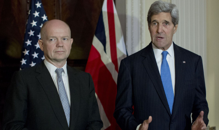 William Hague and John Kerry speaking in London following two days of tense negotiations in Geneva.