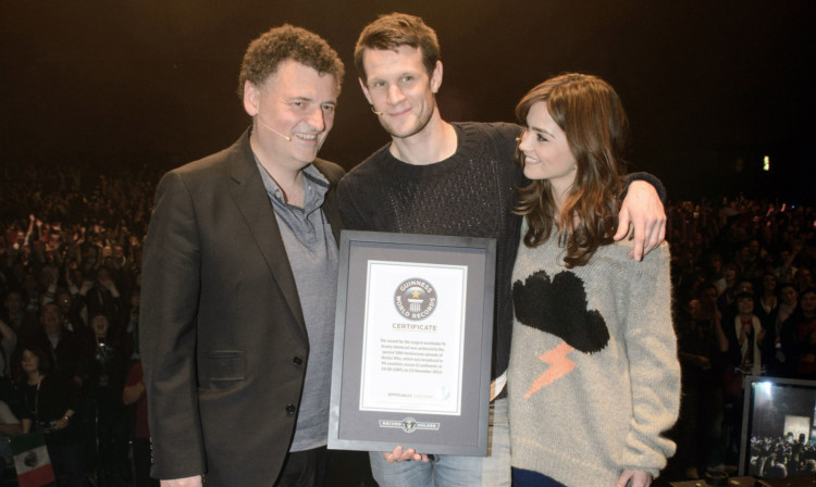 Steven Moffat and actors Matt Smith and Jenna Louise Coleman with the record certificate.