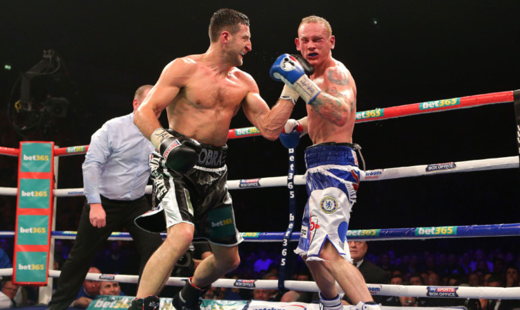Carl Froch lands a punch just before the referee stepped in to end the fight.