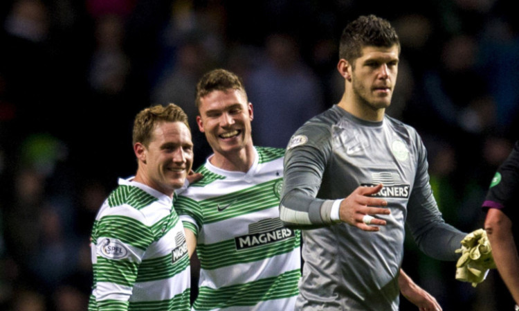 Scorers Kris Commons, left, and Derk Boerrigter join Fraser Forster as they celebrate the win.