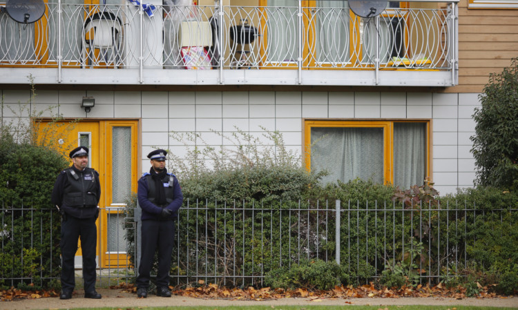 Police continue to stand guard outside a South London block of flats that is being investigated in connection with an alleged slavery case.