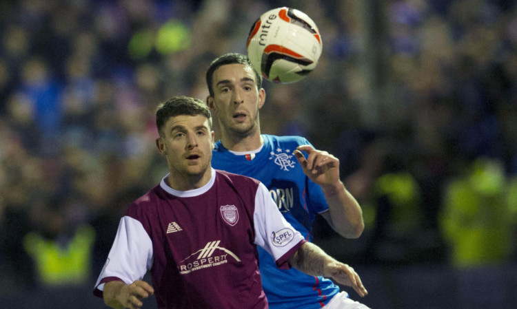 Lichties player Bobby Linn tussles for the ball with Rangers Lee Wallace.