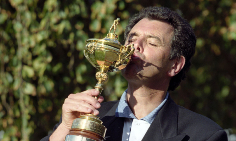 Bernard Gallacher kisses the Ryder Cup after Europe beat the USA in Rochester in 1995.