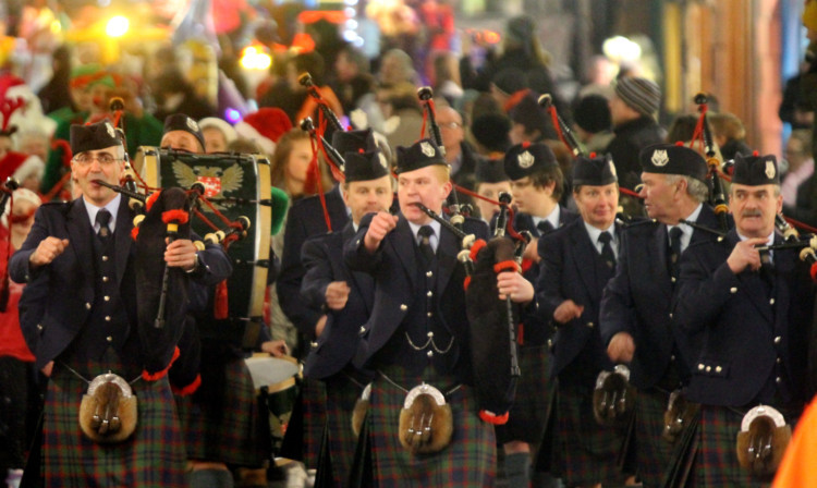 The parade moving through the High Street.