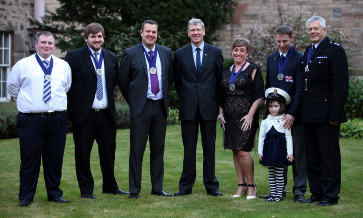 From left; Ross Geddes, Liam Stewart, Ronald McLaren, MSP Kenny MacAskill, Elaine Giles, Barry Gourlay with daughter Isla, and Roy Giles.