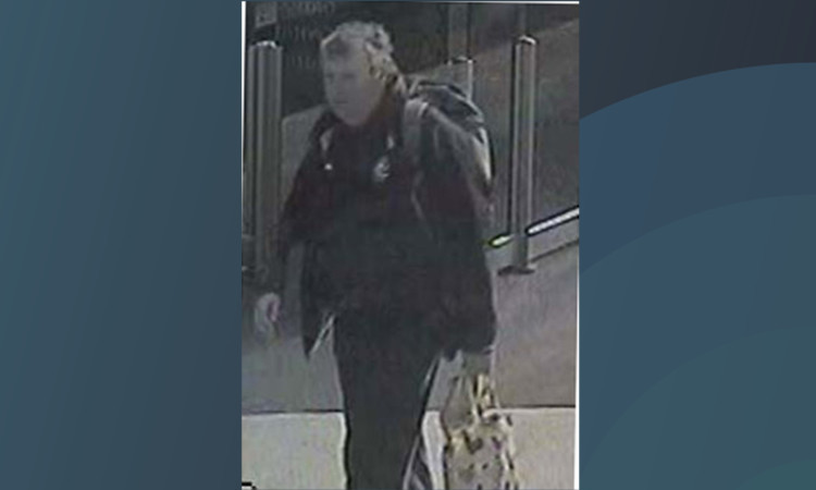 British Transport Police want to trace this man after a flag on a war memorial at Glasgow's Central Station was vandalised.