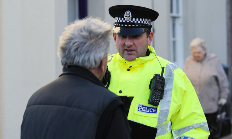 Passers-by being stopped by police in Arbroath.
