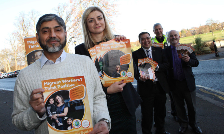 Mohammed Afzad and Marlena Klapczynska, of Mead in Perth, with campaign posters and, from left: Andy Chan, Inspector Ian Scott and Councillor Archie MacLellan.
