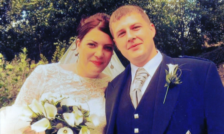 Suzanne and Scott Dove on their wedding day in August.