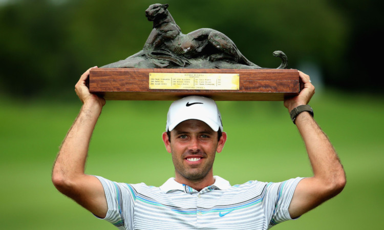 Charl Schwartzel lifts the Alfred Dunhill Championship to clinch a place in the worlds top 20.