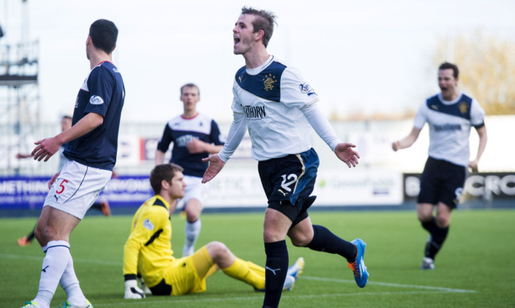 Rangers star David Templeton heads towards the away fans to celebrate his goal.