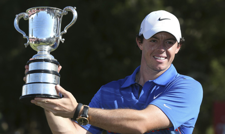 Rory McIlroy celebrate with the trophy after his one-shot win.