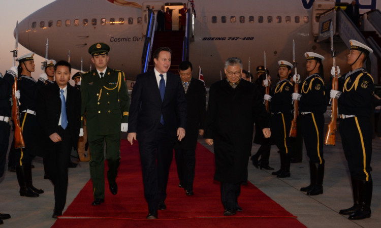 Prime Minister David Cameron arrives in Beijing accompanied by the  largest British trade delegation ever to visit the country for a three day trade visit.