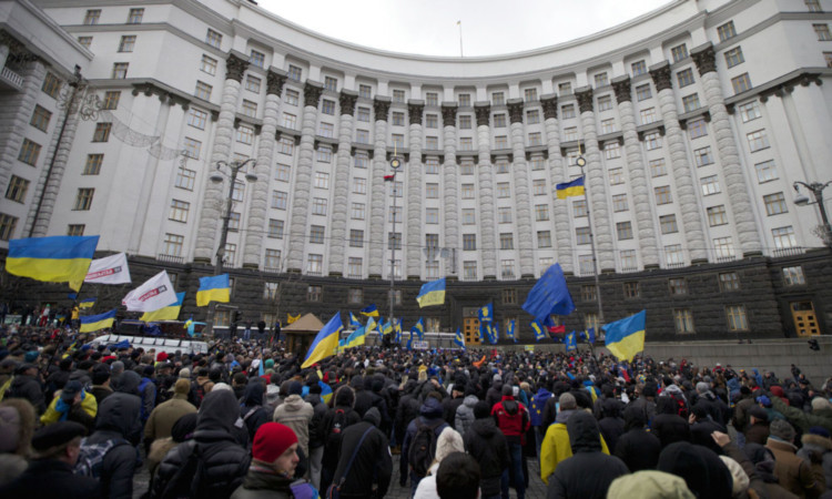 Protesters rally outside the government headquarters in Kiev.