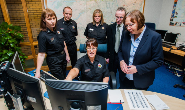 From left: watch manager Morven McDonald, area manager Iain McCusker, station manager Judith Raite, Lesley Scott Tennant, Councillor Fraser Macpherson and Alison McInnes MSP.