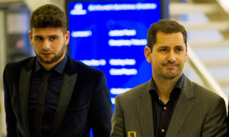 Jackie McNamara leads Nadir Ciftci (left) out of Hampden after his disciplinary hearing.