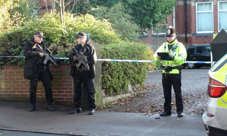 Police at the scene at Cardigan Road in Leeds where a the officer was shot.
