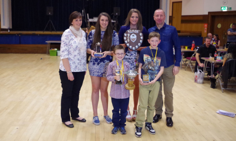 Back, from left: Audrey Forbes, Lucy Richardson, Ellie McCallum and Andy Reid, with front, most improved swimmer Ellis Mackie, left and Daniel Forbes.