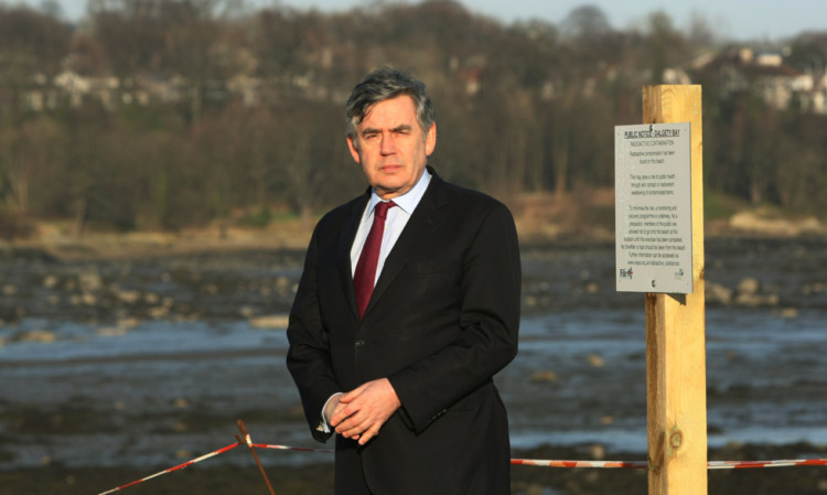 Gordon Brown has talked about 'two wasted seasons' in the clean-up at Dalgety Bay.