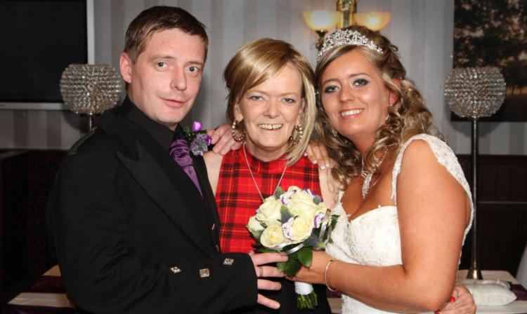 Groom Kevin Soutar and bride Cheryl with her proud mum Michelle Shirkey.