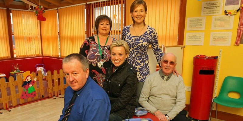 Kim Cessford, Courier - 28.12.10 - Liz McColgan is announced as the new patron of TCCL at Ward 29, Ninewells Hospital - pictured in the play veranda of the paediatric department are front - l to r - John Walker, Liz McColgan and Bob Robertson with back - Gaye Steel and Hazel Melrose