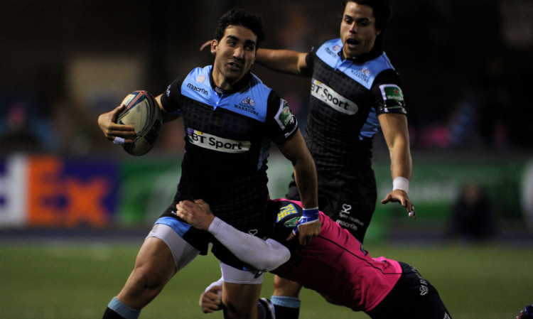 Glasgows Gabriel Ascarate is tackled during his team Heineken Cup defeat at Cardiff.
