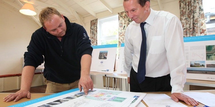 Steve MacDougall, Courier, Cameron Village Hall (nr St Andrews). Developers behind controversial multi-million pound golf development holding exhibition. Pictured, left is member of the public Austin Cameron (from Cameron!) and right is Neil Gray (representing Colliers, please check title against copy from Aileen in Kirkcaldy office). The pair are looking at some of the plans for the area.