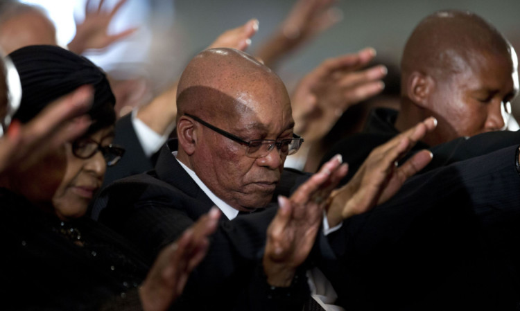 Winnie Madikizela-Mandela, Nelson Mandela's former wife, and South African President Jacob Zuma pray during a memorial service for Mandela at the Bryanston Methodist Church in Johannesburg on Sunday.