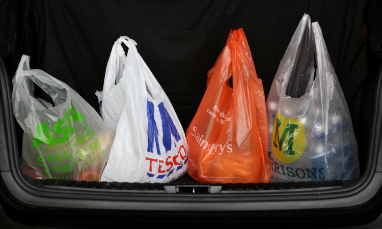 General view of Shopping bags from the four major supermarkets Asda, Tesco, Sainsbury's and Morrisons, in a car boot in Cambridge. PRESS ASSOCIATION Photo. Picture date:Wednesday October 2, 2013. See PA story. Photo credit should read: Chris Radburn/PA Wire