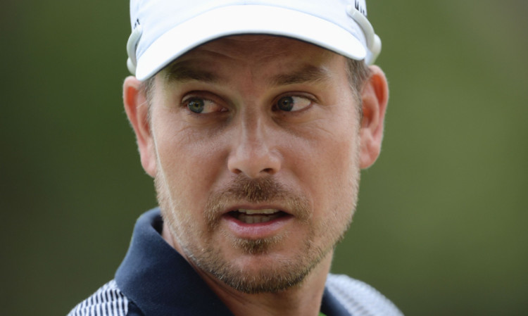 SUN CITY, SOUTH AFRICA - DECEMBER 03:  Henrik Stenson of Sweden looks on during the pro - am prior to the start of the Nedban Golf Challenge at Gary Player CC on December 3, 2013 in Sun City, South Africa.  (Photo by Stuart Franklin/Getty Images)