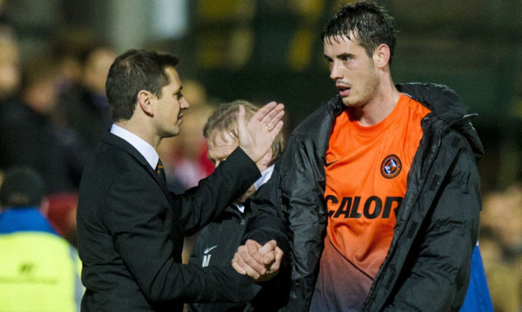 Jackie McNamara congratulates Brian Graham, who is now on a three-game scoring run. Goals are coming from throughout the team as United enjoy a hot spell of form.
