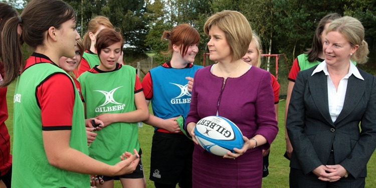 John Stevenson, Courier, 30/08/11. Fife, Kirkcaldy,Cluny Clays, Pics shows Deputy First Minister Nicola Sturgeon who hosted a lunchtime reception celebrating the Year of Active Scotland. Pic shows Nicola with rugby ball and Shona Robison as they chat to pupils from Glenwood High School.