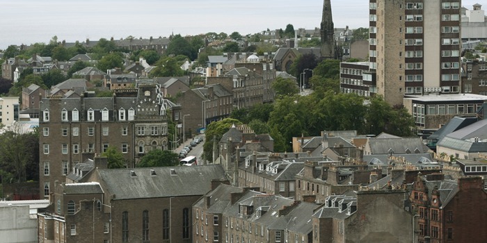 Aerial view of Dundee - looking west, with the University of Dundee tower block and the Queens Hotel in the shot.