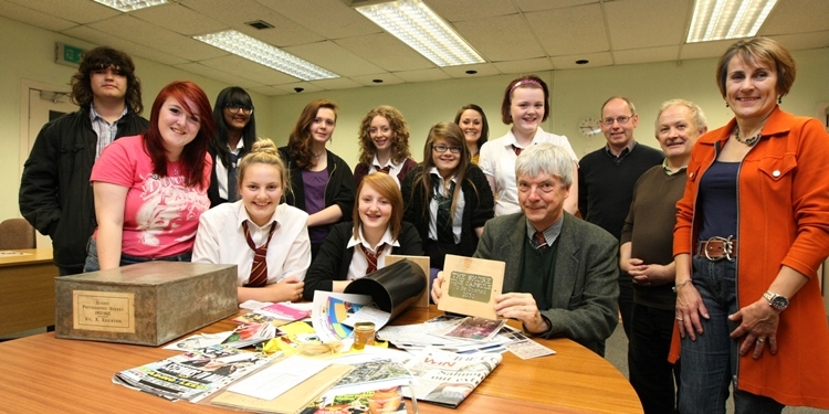 DOUGIE NICOLSON, COURIER, 30/08/11, NEWS. Pictured at the City Archives today, Tuesday 30th August 2011, are the kids from The Shore,with the contents to be put in the time capsule, and Iain Flett, seated, Dundee City Council Archivist, with RIGHT TO LEFT standing Gail Thomson - Manager at The Shore, Stan Bremner - Community Learning & Development Worker, Brian Kelly - Dundee Heritage Trust, and Ruth Chalmers - Art Worker at The Shore (5th from right, back). Story by Reporters.