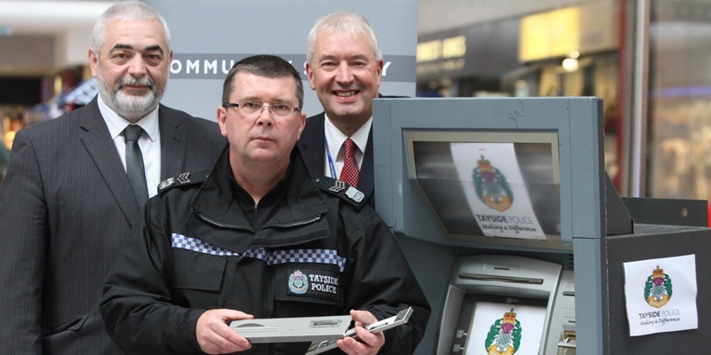 Steve MacDougall, Courier, St John's Shopping Centre, Perth. Photocall for warning about cash machine scam. Pictured, left to right is Matt Ronan (Scottish Business Crime Centre), Steve Sangster (Crime Reduction Sergeant, Tayside Police) and Ian Campbell (Perth Safer Cities Programme Manager), alongside  an example cash machine and some of the false plates that can be fitted to the machines.