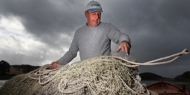 Krisd Miller, Courier, 06/09/11. Picture today at Salmon Fishery on the Tay near Perth. Pic shows David Gardiner, Ex Salmon Netsman who is helping the Fisheries with experimental netting. Pic is David with nets on back of boat.