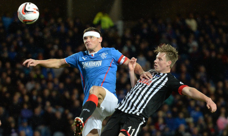 Jordan Moore in a tussle with Rangers captain Lee McCulloch.