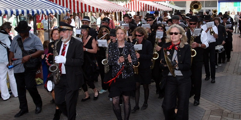 King Edward Street, Perth. Perth Farmers' Market. Pictured, the 'March Mellows Streetband' march through the market. The band are from Aschaffenburg (Perth's twin city in Germany) and are here to join in the Perth 800 celebrations.