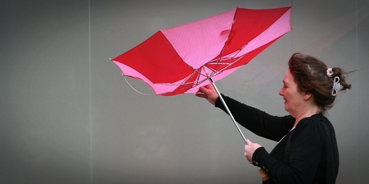 Kris Miller, Courier, 12/09/11. Picture today at Scott Street, Perth shows shoppers umbrella being turned inside out by high winds from Hurricane Katia.