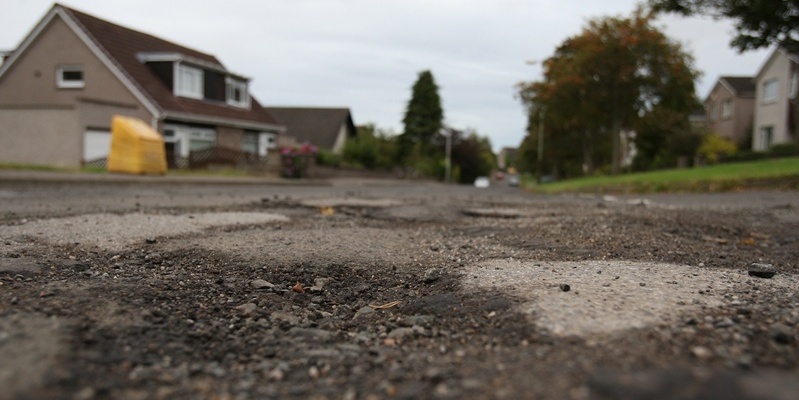 Kris Miller, Courier, 13/09/11. Picture today shows potholes and patches on Falkland Crescent for story about state of roads.