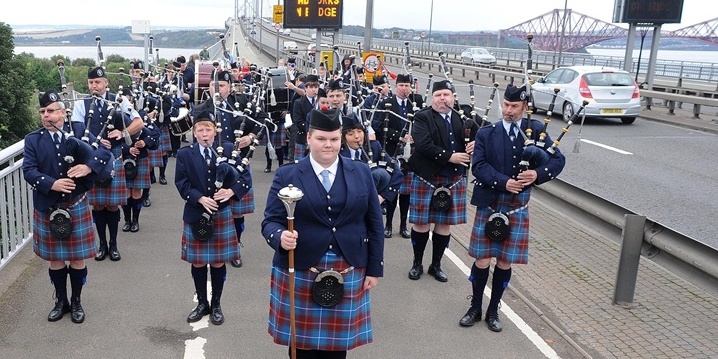 Burntisland pipe band get ready to cross the Forth Bridge